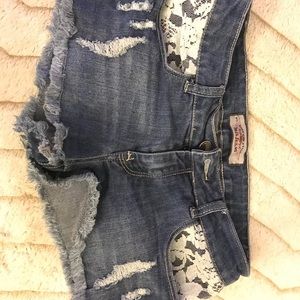 Torn jean shorts with lace